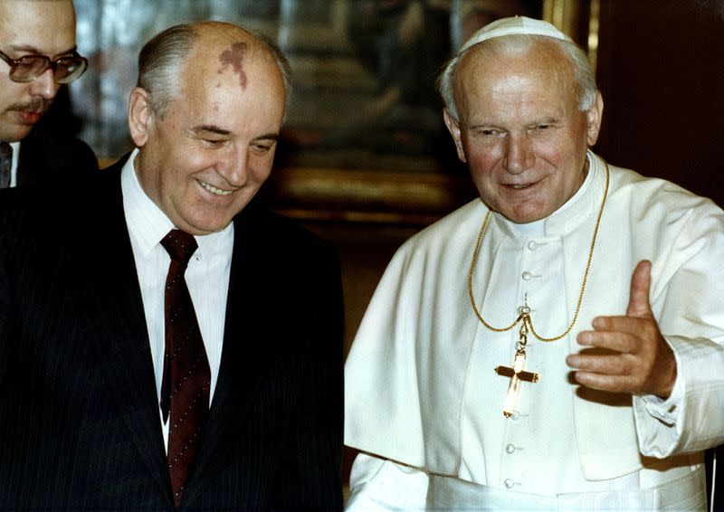 FILE PHOTO: Pope John Paul II talks with former Soviet President Mikhail Gorbachev during an audience at the Vatican