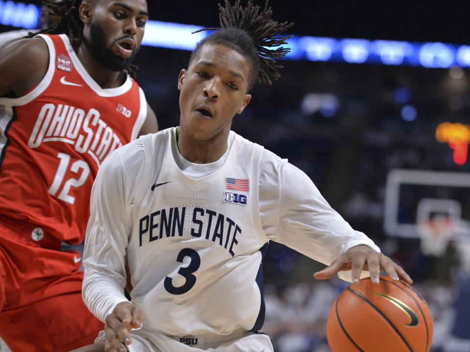 Penn State's Nick Kern Jr. (3) is defended by Ohio State's Evan Mahaffey (12) during the first half of an NCAA college basketball game Saturday, Dec. 9, 2023, in State College, Pa. (AP Photo/Gary M. Baranec)