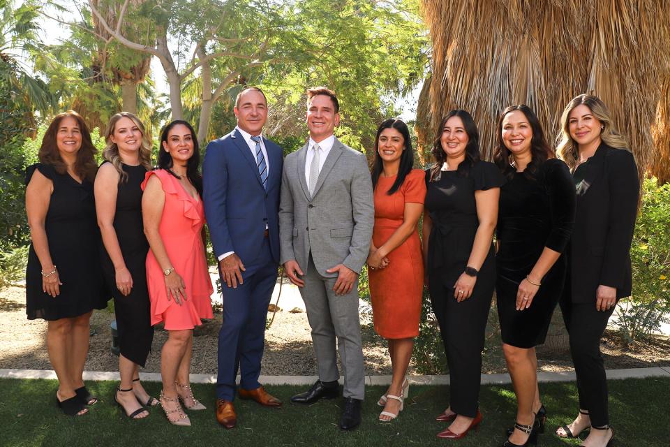 Erwin and Jochen pose with the staff of Contour Dermatology.