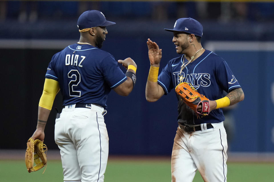 Tampa Bay Rays center fielder Jose Siri celebrates with third baseman Yandy Diaz (2) after the team defeated the Toronto Blue Jays during a baseball game Wednesday, Aug. 3, 2022, in St. Petersburg, Fla. (AP Photo/Chris O'Meara)