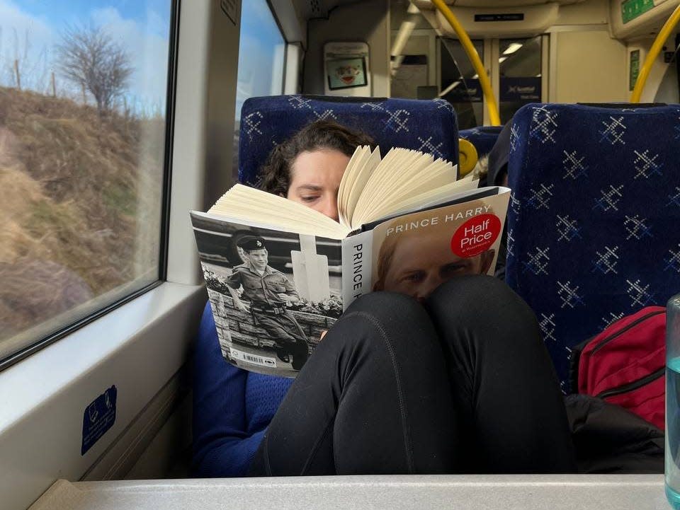 Insider reporter Talia Lakritz reading on a train in Scotland.