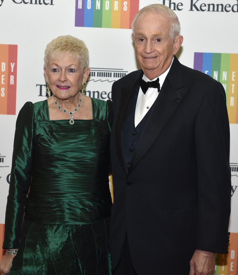 Marriott International Executive Chairman and Chairman of the Board Marriott, Jr, and his wife Garff pose for photographers as they arrive at the U.S. State Department for a gala dinner to honor the 2013 Kennedy Center Honorees, in Washington