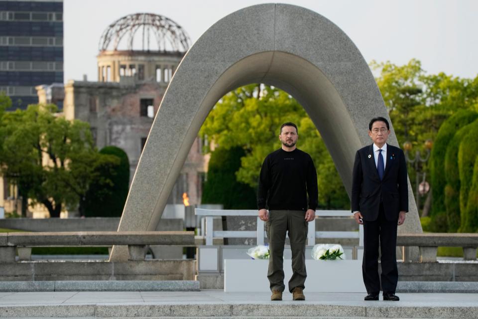 Ukrainian President Volodymyr Zelenskyy and Japanese Prime Minister Fumio Kishida attend the Cenotaph for the Victims of the Atomic Bomb, before laying flowers at the Hiroshima Peace Memorial Park following the G7 Summit on May 21, 2023, in Hiroshima, Japan.