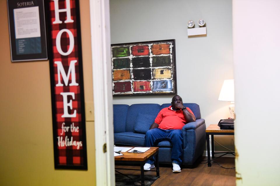 Henry Thomas, Soteria resident, sits inside the house waiting for a financial literacy course to begin on Monday, April 10, 2023.