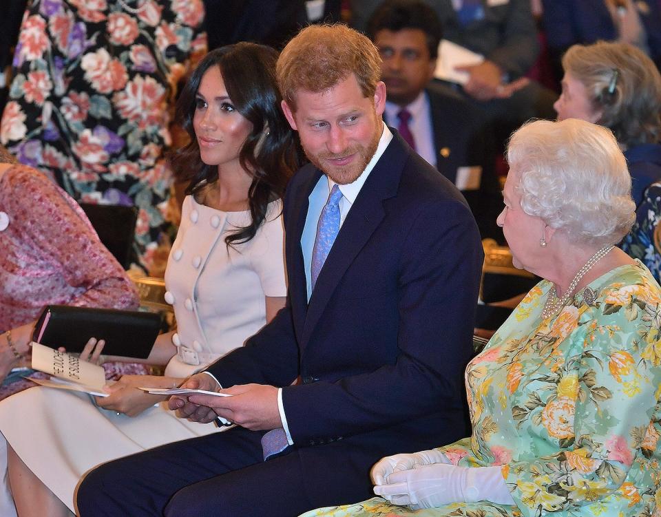 Prince Harry and his grandmother share a look at the Queen's Young Leaders Awards Ceremony at Buckingham Palace in June 2018. 