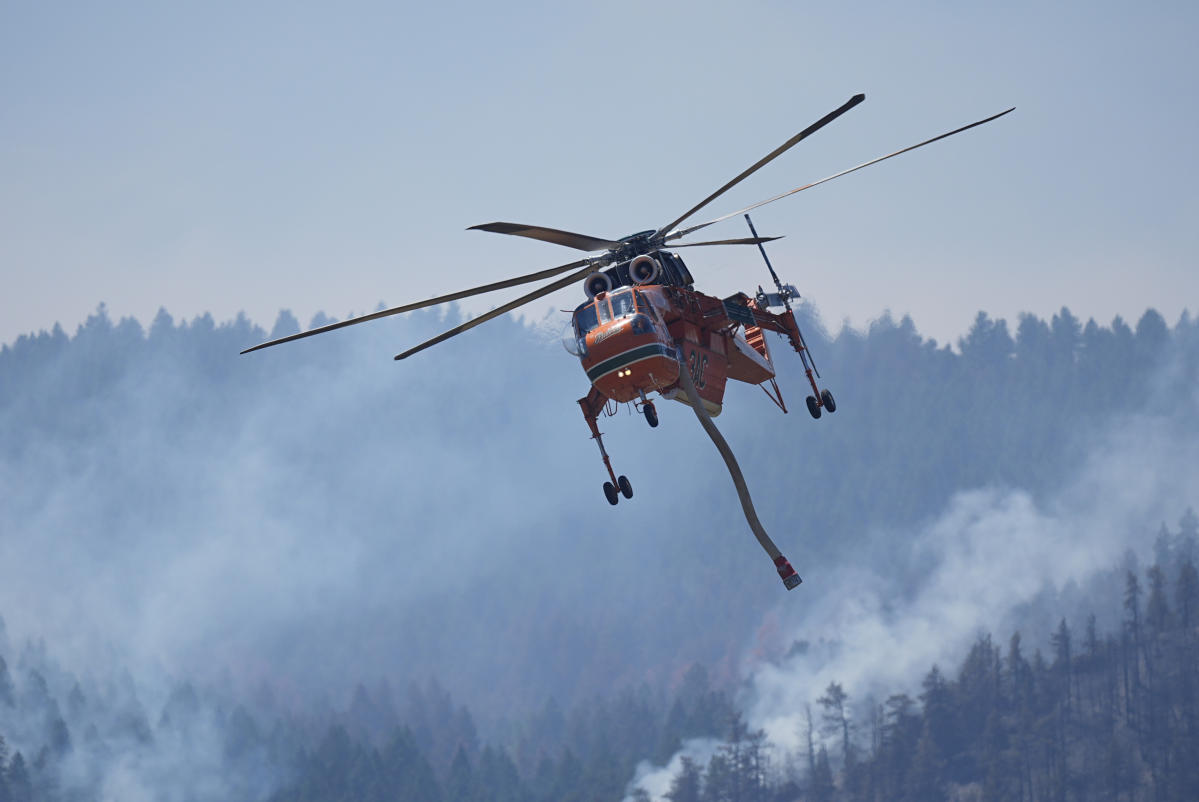 Wildfires encroach on homes near Denver as firefighters face sweltering heat