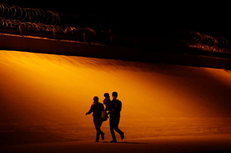 Migrants are seen after crossing the Rio Bravo river to turn themselves in to U.S. Border Patrol agents to request for asylum in El Paso, Texas, U.S., as seen from Ciudad Juarez