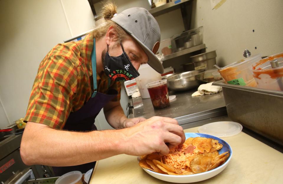 Executive Chef Ryan Allen works on a special pimento cheese dish during lunch at Barrister’s inside the Esquire Hotel	on West Main Avenue in Gastonia Friday afternoon, September 3, 2021.