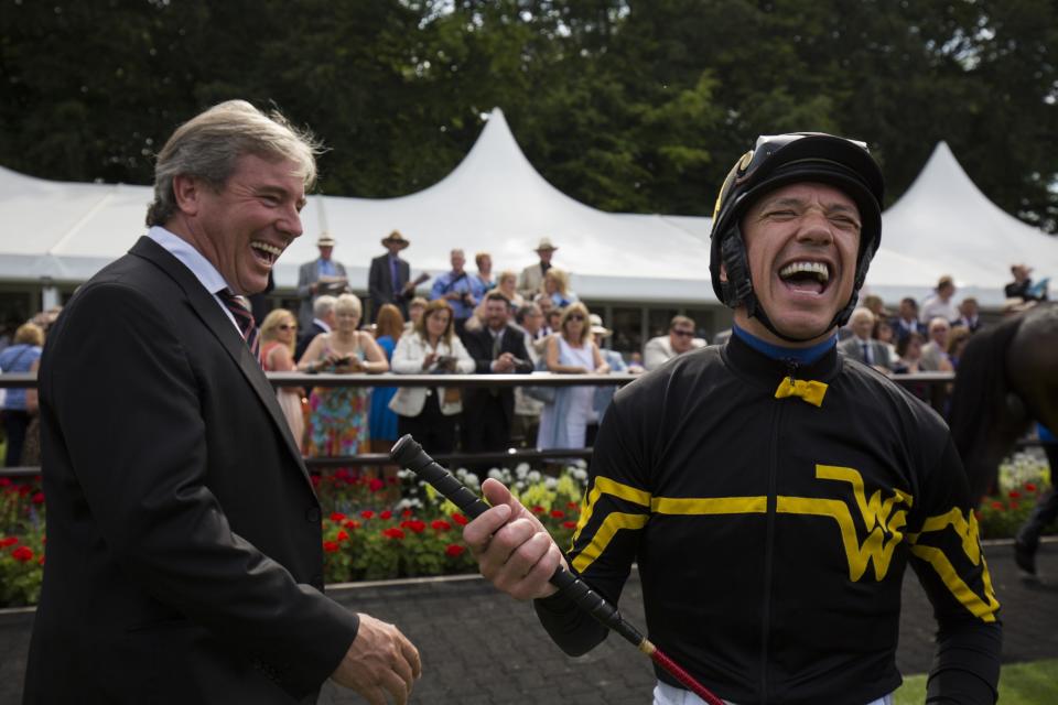 American trainer Wesley Ward shares a joke with jockey Frankie Dettori