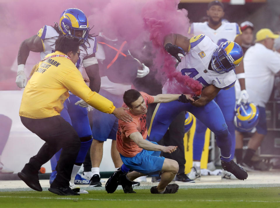 A protester who ran onto the field during Monday Night Football has filed an assault complaint against the Los Angeles Rams, a spokesperson for the Santa Clara Police department told Yahoo Sports. (Jane Tyska/Digital First Media/East Bay Times via Getty Images)