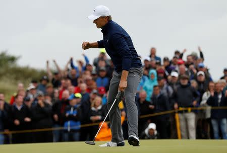 USA’s Jordan Spieth reacts after holing his birdie putt on the 16th green during the final round REUTERS/Andrew Boyers