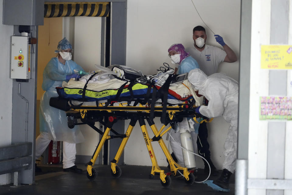 A patient infected with the Covid-19 virus is admitted in an hospital Wednesday April 1, 2020 in Rennes, western France. France is evacuating 36 patients infected with the coronavirus from the Paris region onboard two medicalized high-speed TGV trains. The patients, all treated in intensive care units (ICU), are being transferred to several hospitals in Britany, as western France is less impacted by the epidemic. The new coronavirus causes mild or moderate symptoms for most people, but for some, especially older adults and people with existing health problems, it can cause more severe illness or death. (AP Photo/David Vincent)