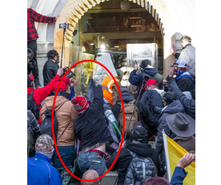 Individual resembling Nicholas Languerand   is seen throwing objects at law enforcement on Jan. 6, 2021, according to government exhibit. / Credit: U.S. Government exhibit