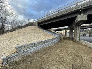 A view of winter construction progress on the retaining wall under the I-89 bridge at exit 16 in Colchester. The retaining wall creates space for a shared-use path that will run parallel to the road.