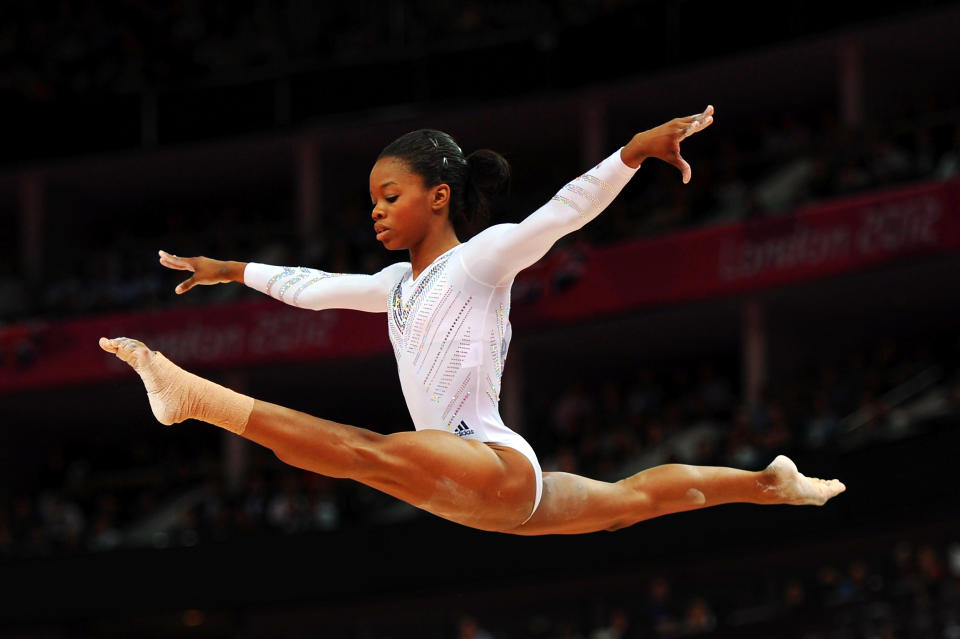 3) Gabrielle Douglas won both team gold and all-around gold in gymnastics. When was the last time a female gymnast accomplished that feat?<br><br> A) 2004<br> B) 2000<br> C) 1992<br> D) 1984 <br><br>(Photo by Michael Regan/Getty Images)