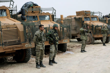 Turkish forces are seen near Mount Barsaya, northeast of Afrin, Syria January 22,2018. REUTERS/Khalil Ashawi