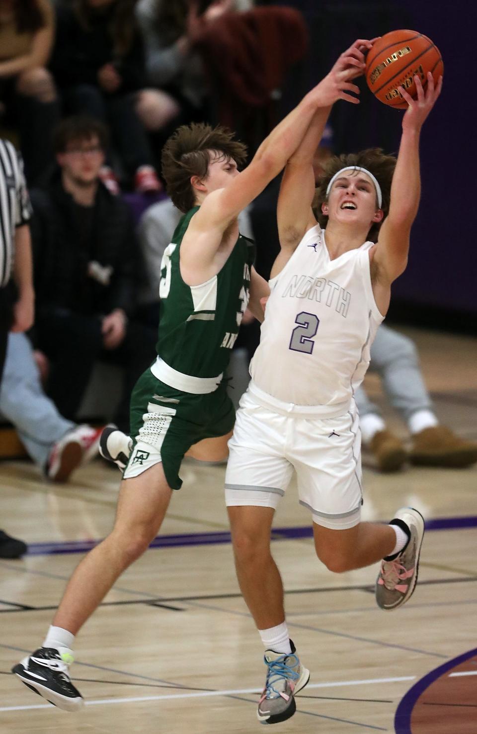 North Kitsap's Mason Chmielewski (2) grabs a pass intended for Port Angeles's Parker Nickerson (35) during the second half of their game on Tuesday, Jan 3, 2023.