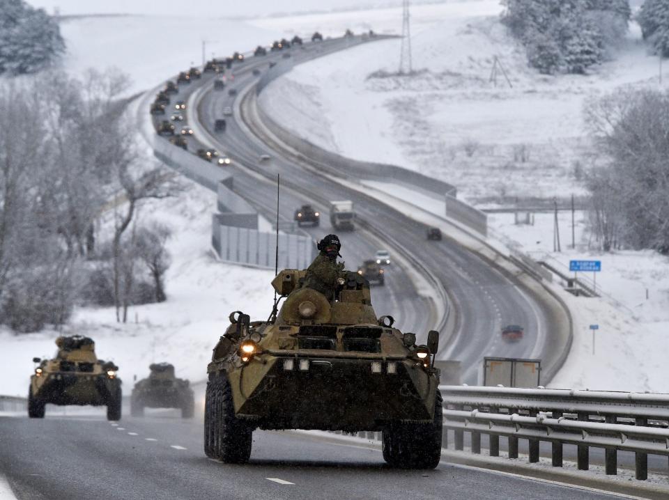 A convoy of Russian armored vehicles moves along a highway in Crimea.