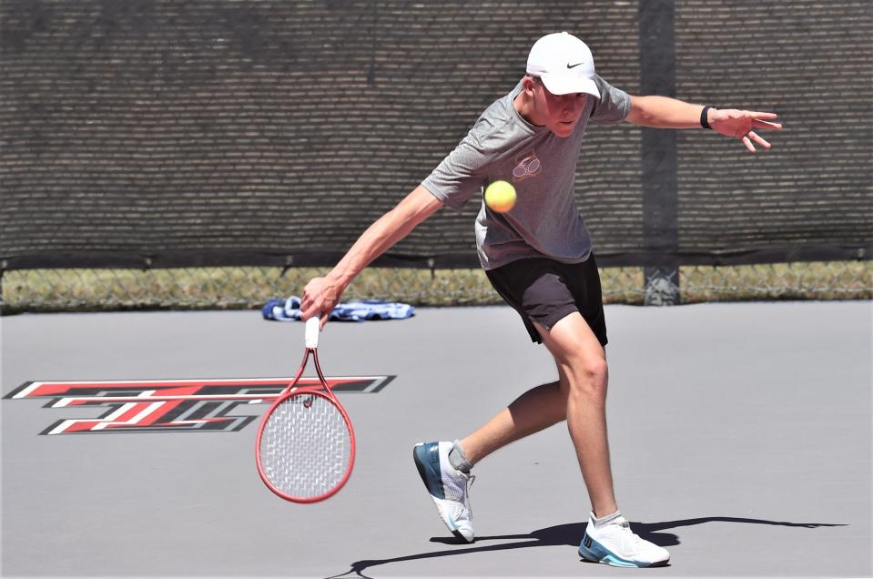 Abilene High's Griffin Sullivan returns a shot against Olise Roberts in a Region I-5A boys singles semifinal match April 10 in Lubbock. Sullivan won 6-2, 6-2.