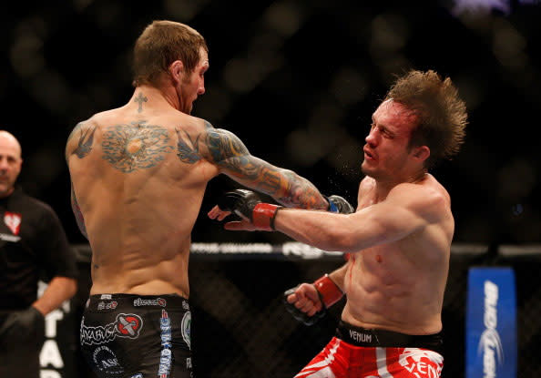 (L-R) Eddie Wineland versus Brad Pickett during their bantamweight fight at UFC 155 on December 29, 2012 at MGM Grand Garden Arena in Las Vegas, Nevada. (Photo by Josh Hedges/Zuffa LLC/Zuffa LLC via Getty Images)