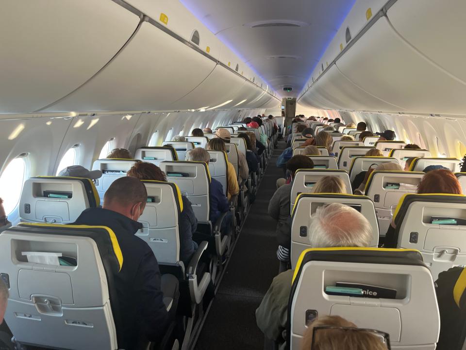 Passengers are seated in a 132-seat Breeze Airways Airbus A220 flying to Hartford, Connecticut, on March 25, 2023.