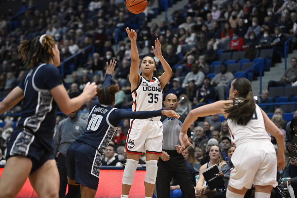 UConn's Azzi Fudd (35) shoots a 3-point basket in the first half of an NCAA college basketball game against Georgetown, Sunday, Jan. 15, 2023, in Hartford, Conn. (AP Photo/Jessica Hill)