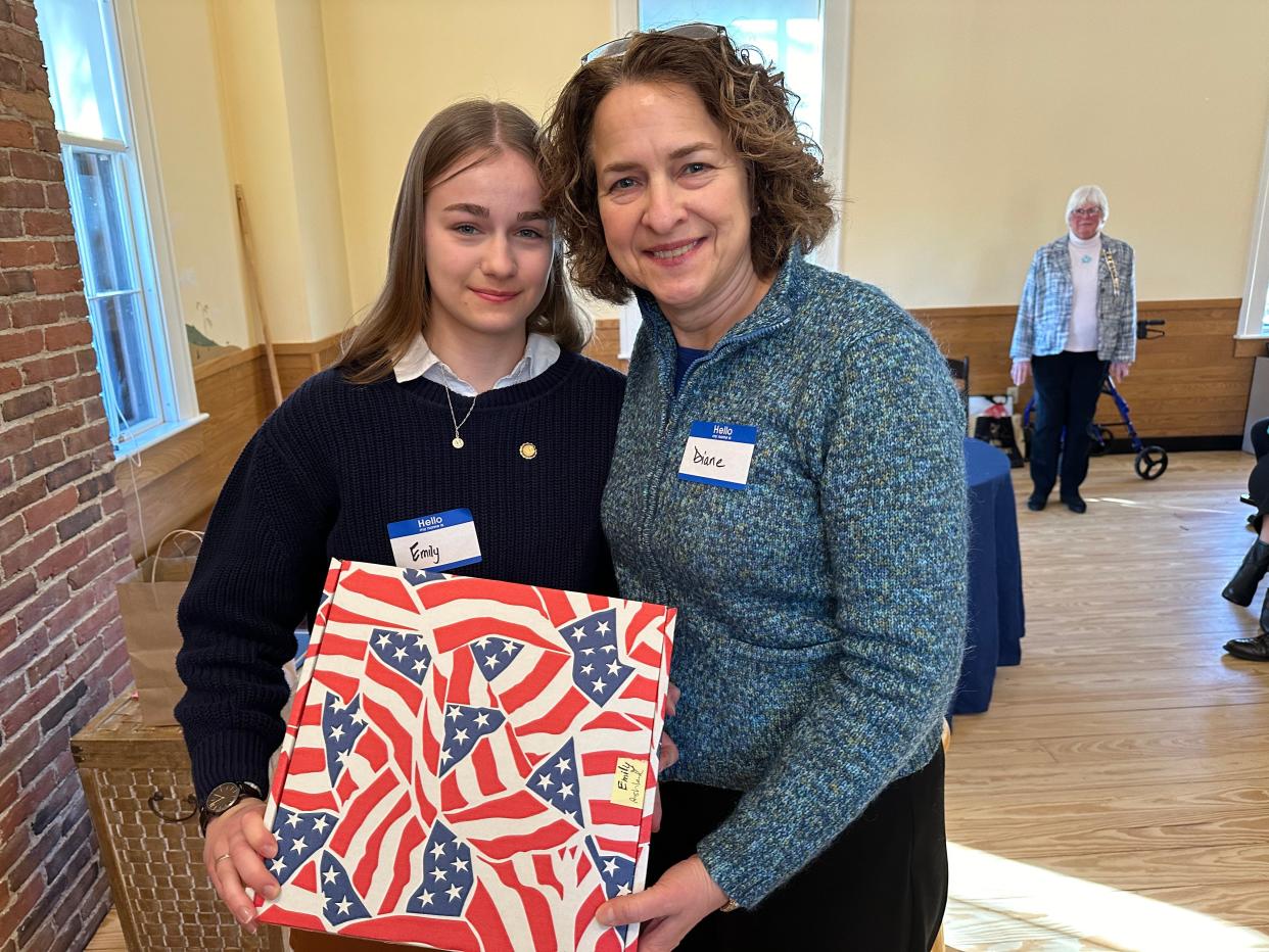 Ashland High School senior Emily Umholtz, left, with her mother, Diane Umholtz, after being named winner of the Framingham chapter of the Daughters of American Revolution essay winner.