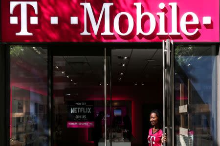 FILE PHOTO: A T-Mobile sign on top of a T-Mobile retail store in Manhattan, New York, U.S. on September 22, 2017. REUTERS/Amr Alfiky/File Photo