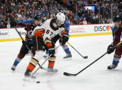 Anaheim Ducks left wing Rickard Rakell (67) chases down the puck in the corner as Colorado Avalanche center Tyson Jost (17) defends during the second period in an NHL hockey game Wednesday, March 4, 2020 in Denver. (AP Photo/John Leyba)