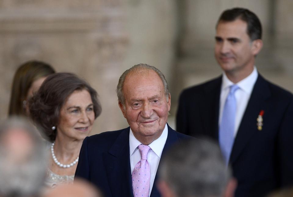 (L TO R) Spain&#39;s Queen Sofia, Spain&#39;s former King Juan Carlos I and Spain&#39;s Crown Prince Felipe leave after the ceremony of approval and enactment of a law bringing into effect King Juan Carlo&#39;s abdication in the Columns Hall at the Royal Palace in Madrid on June 18, 2014. Spanish King Juan Carlos announced his abdication on June 2, 2014 in favour of his son Prince Felipe who tomorrow will swear an oath infront of both houses of parliament, ending a 39-year reign that guided Spain from dictatorship to democracy but was later battered by royal scandals. AFP PHOTO / GERARD JULIEN        (Photo credit should read GERARD JULIEN/AFP via Getty Images)