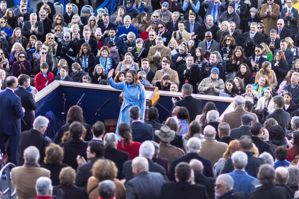 Kentucky Lt. Gov. Jacqueline Coleman waves to the crowd before taking the oath of office outside the state Capitol in Frankfort, Ky., on Tuesday, Dec. 12, 2023. Ryan C. Hermens/rhermens@herald-leader.com