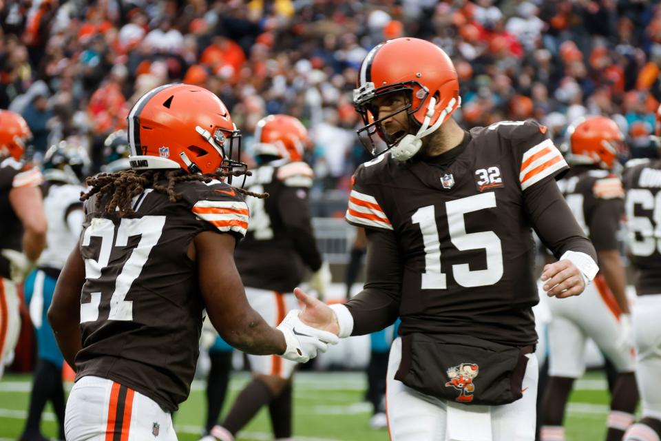 Cleveland Browns running back Kareem Hunt (27) is greeted by quarterback Joe Flacco (15) after scoring a 4-yard rushing touchdown during the second half Sunday against the Jacksonville Jaguars in Cleveland.