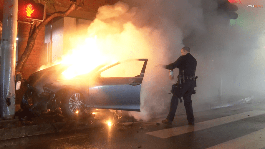 Police respond to a fiery crash in Encino on Feb. 20, 2024.