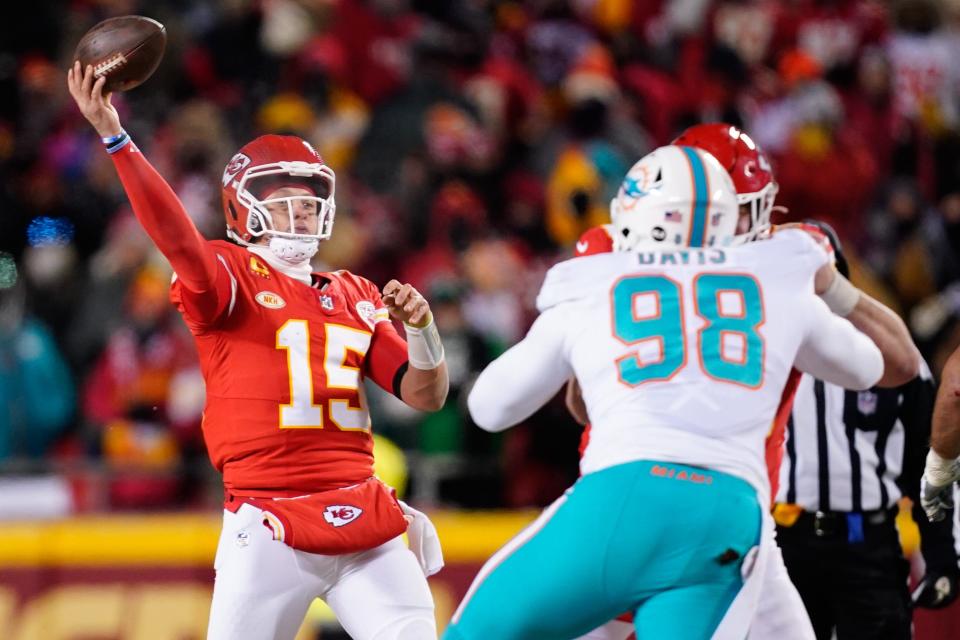 Jan 13, 2024; Kansas City, Missouri, USA; Kansas City Chiefs quarterback Patrick Mahomes (15) throws under pressure against Miami Dolphins defensive tackle Raekwon Davis (98) during the first half of the 2024 AFC wild card game at GEHA Field at Arrowhead Stadium. Mandatory Credit: Jay Biggerstaff-USA TODAY Sports