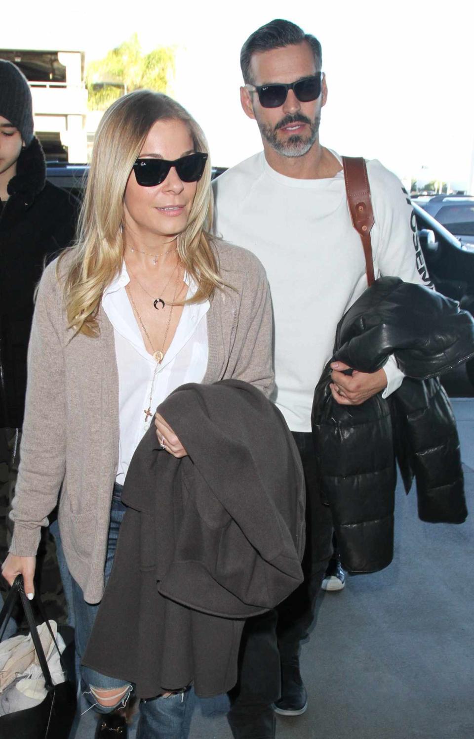 LeAnn Rimes and Eddie Cibrian are seen at LAX on December 28, 2016 in Los Angeles, California