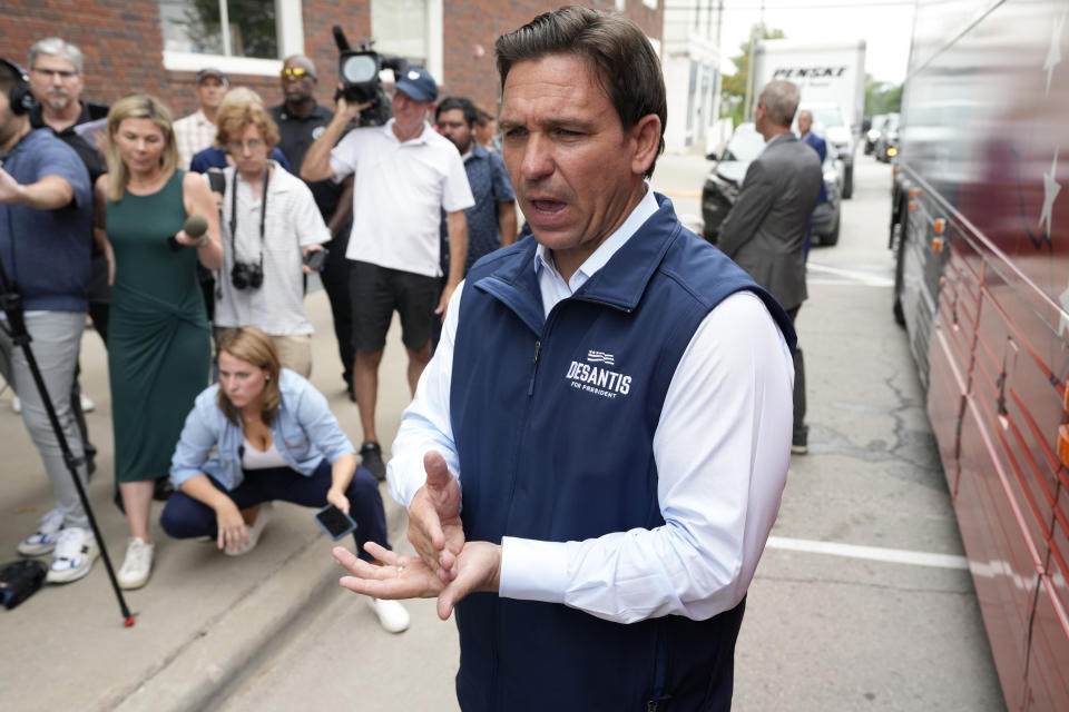 Republican presidential candidate Florida Gov. Ron DeSantis speaks to reporters following a meet and greet at the Hotel Charitone, Thursday, July 27, 2023, in Chariton, Iowa. Donald Trump and rival Ron DeSantis will appear for the first time at the same campaign event in early voting Iowa on Friday at a pivotal moment for the Republican presidential candidates. (AP Photo/Charlie Neibergall)