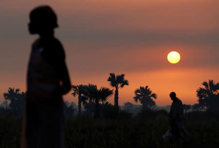 A woman waits to be registered prior to a food distribution carried out by the United Nations World Food Programme (WFP) in Thonyor, Leer state, South Sudan, February 26, 2017. REUTERS/Siegfried Modola