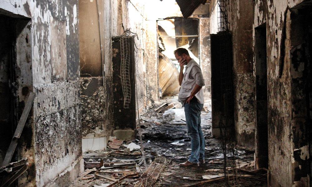A Médecins Sans Frontières worker walks inside the remains of a hospital destroyed by a US airstrike in Kunduz in 2015.