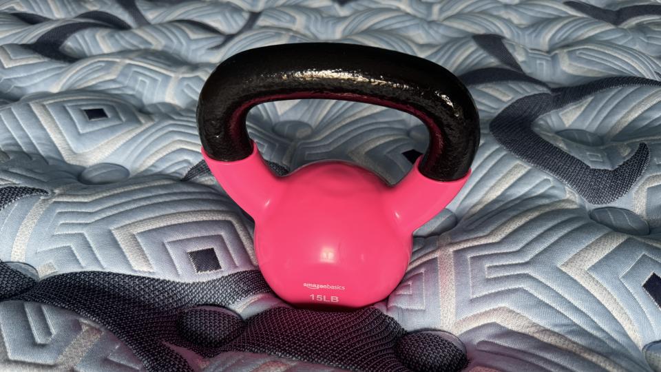 Testing the pressure relief for the Stearns & Foster Estate mattress review by using a kettlebell