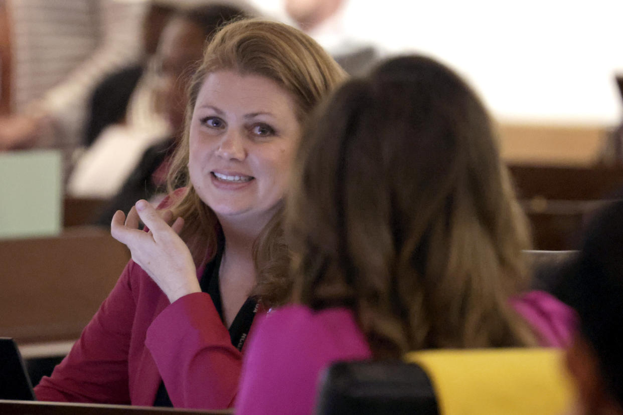 Rep. Erin Paré (R), left, confers with Tricia Ann Cotham (R), right, Tuesday, May 16, 2023, in Raleigh, N.C., as the North Carolina House members debate whether to override Democratic Gov. Roy Cooper's veto of a bill that would change the state's ban on nearly all abortions from those after 20 weeks of pregnancy to those after 12 weeks of pregnancy. Both the Senate and House had to complete successful override votes for the measure to be enacted into law. The Senate voted to override the veto earlier and the House also voted to override. (AP Photo/Chris Seward)