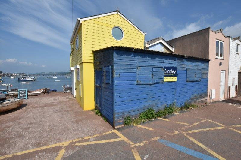 This small blue shed could be yours for upwards of £69K (Image: Bradleys Estate Agents/SWNS) 