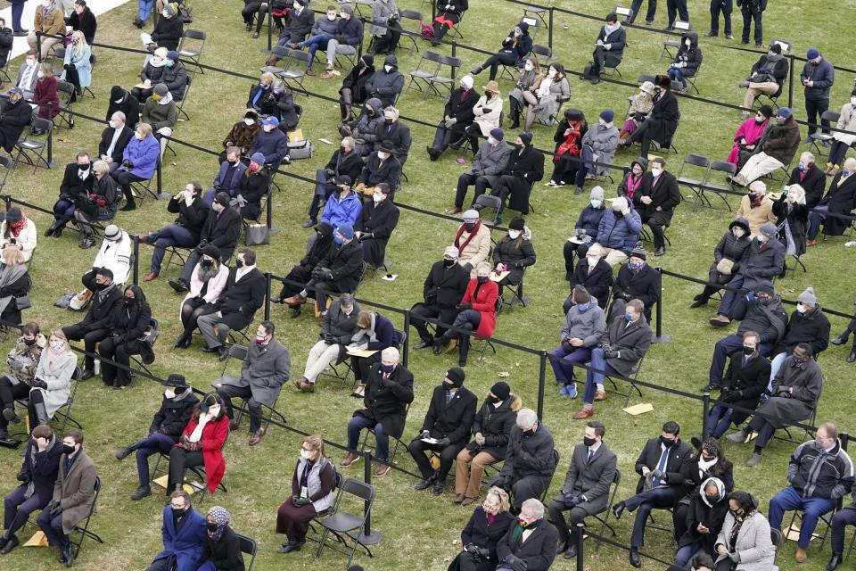 <p>A socially distanced crowd watches from the lawn of the U.S. Capitol. </p>