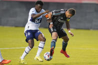 Los Angeles Galaxy Chichartio, right, battles with Vancouver Whitecaps defender Javain Brown, left, in the first half during an MLS soccer match Wednesday, June 23, 2021, in Sandy, Utah. (AP Photo/Rick Bowmer)