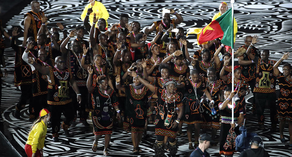 The Cameroon team marches into Carrara Stadium for the opening ceremony for the 2018 Commonwealth Games on the Gold Coast. Some team members were later reported missing from the village. Source: Reuters