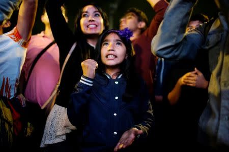 Supporters of presidential candidate Andres Manuel Lopez Obrador react outside a hotel while waiting for the presidential election results in downtown Mexico City, Mexico July 1, 2018. REUTERS/Alexandre Meneghini