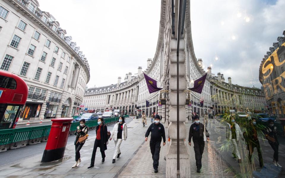 Shoppers wearing protective face masks on Regent Street, London - Dominic Lipinski/PA