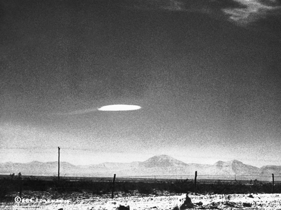 A UFO variety was photographed when it hovered for fifteen minutes near Holloman Air Development Center in New Mexico. The object was photographed by a government employee and was released by the Aerial Phenomena Research Organization after careful study. There is no conventional explanation for the object.