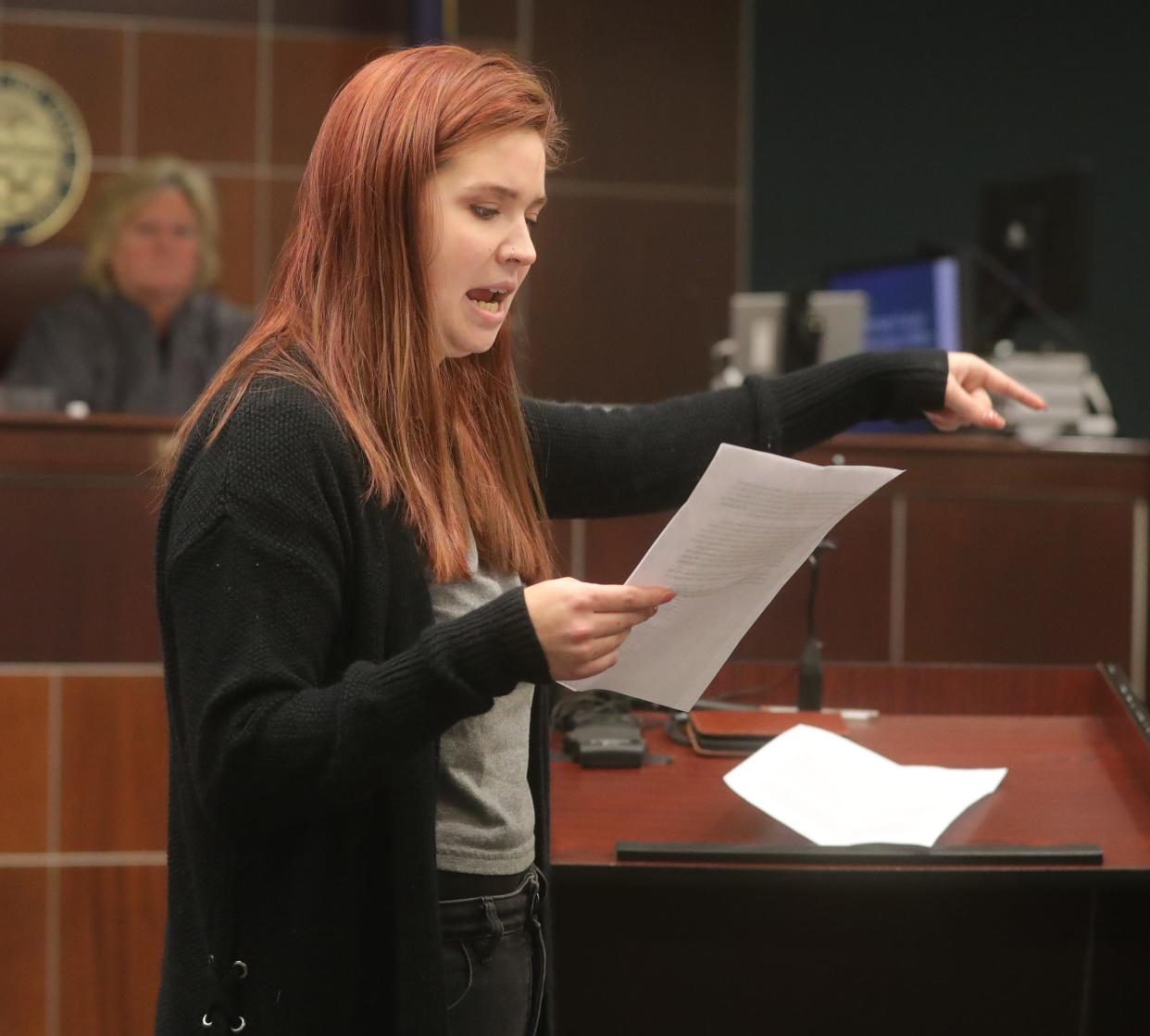 Amanda Paxton points at her mother, Julianne Shead, while giving her victim impact statement Wednesday at the Portage County Courthouse in Ravenna. Shead pleaded guilty for her actions in a drunken driving crash that killed three passengers, including two of Paxton's sisters.