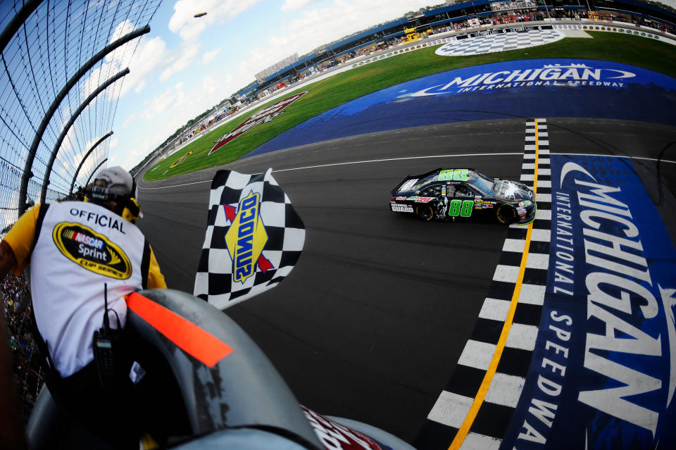 BROOKLYN, MI - JUNE 17: Dale Earnhardt Jr., driver of the #88 Diet Mountain Dew/TheDarkKnightRises/National Guard/ Chevrolet, crosses the finishline to win the NASCAR Sprint Cup Series Quicken Loans 400 at Michigan International Speedway on June 17, 2012 in Brooklyn, Michigan. (Photo by Jared C. Tilton/Getty Images)