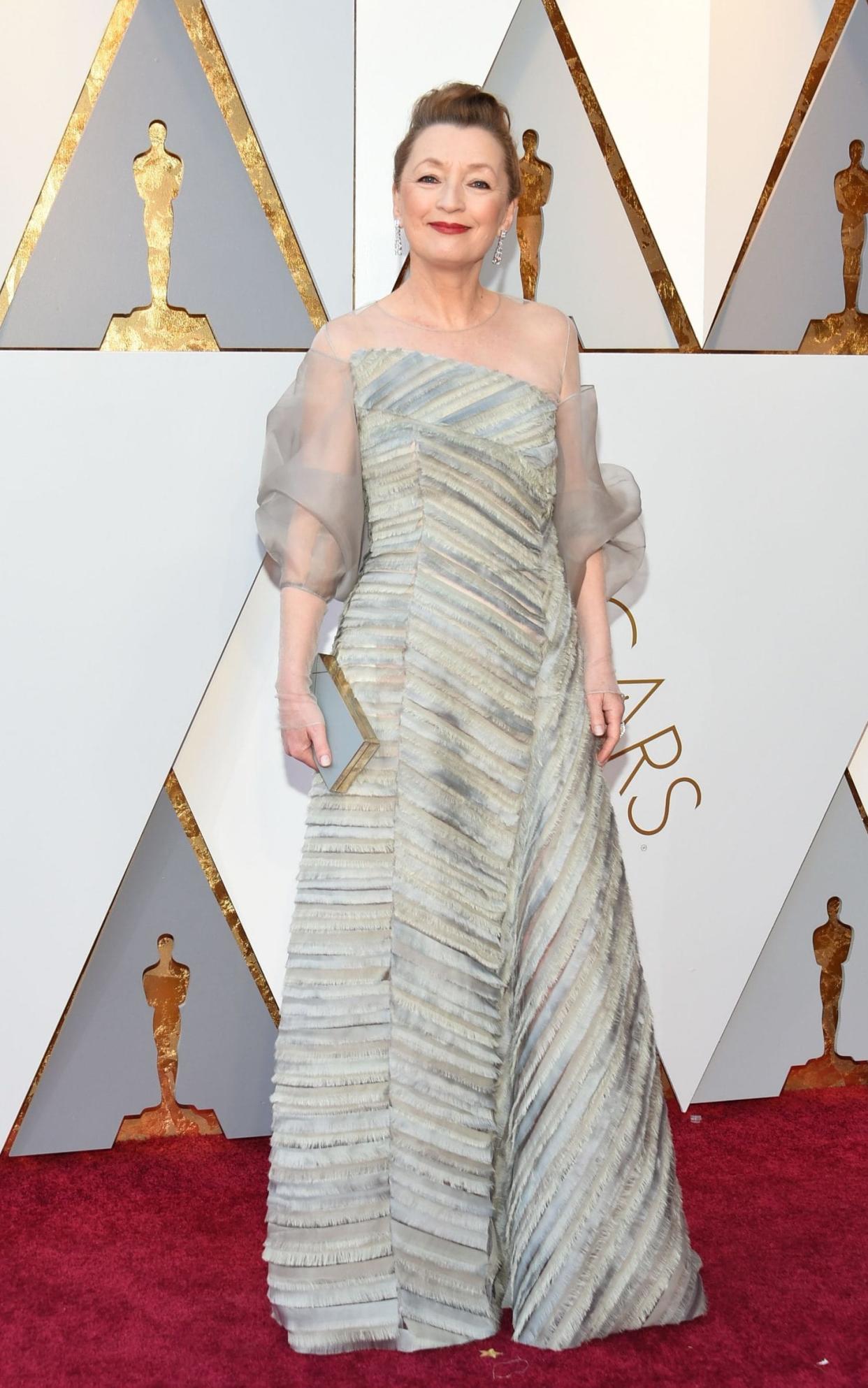 British Lesley Manville, wearing Anna Valentine, arrives at the Oscars 2018 - AFP